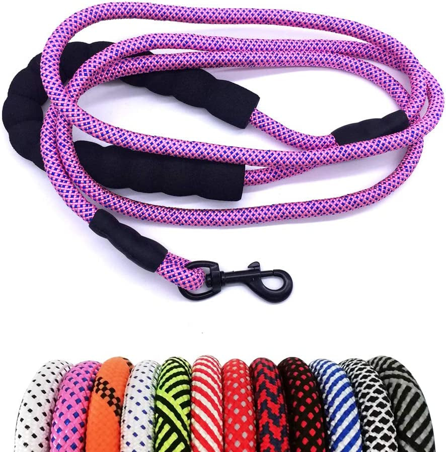 Pink and black patterned dog leash with a clip on a white background, surrounded by other colorful leashes.