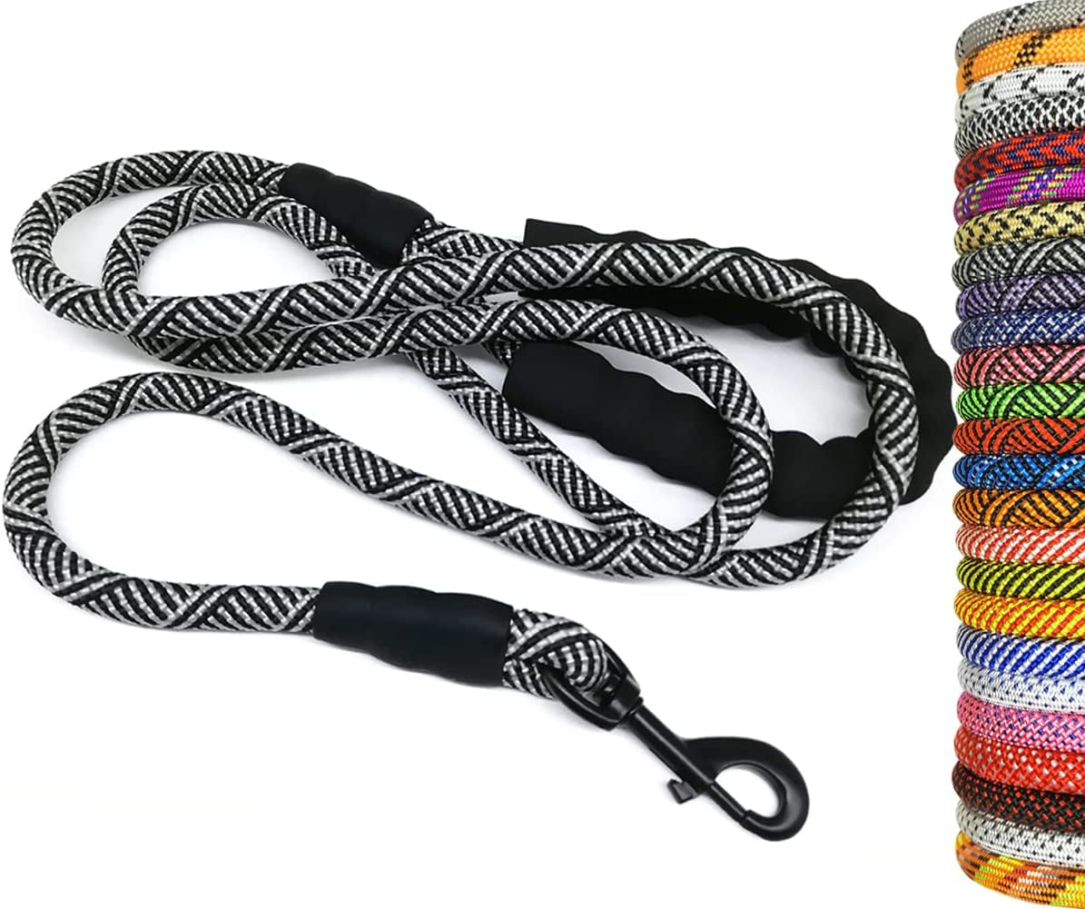 Black and white braided dog leash with a carabiner clip on a white background, surrounded by additional colorful leashes.