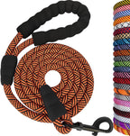 Dog leash with black handles and orange pattern, alongside a colorful selection of leashes.