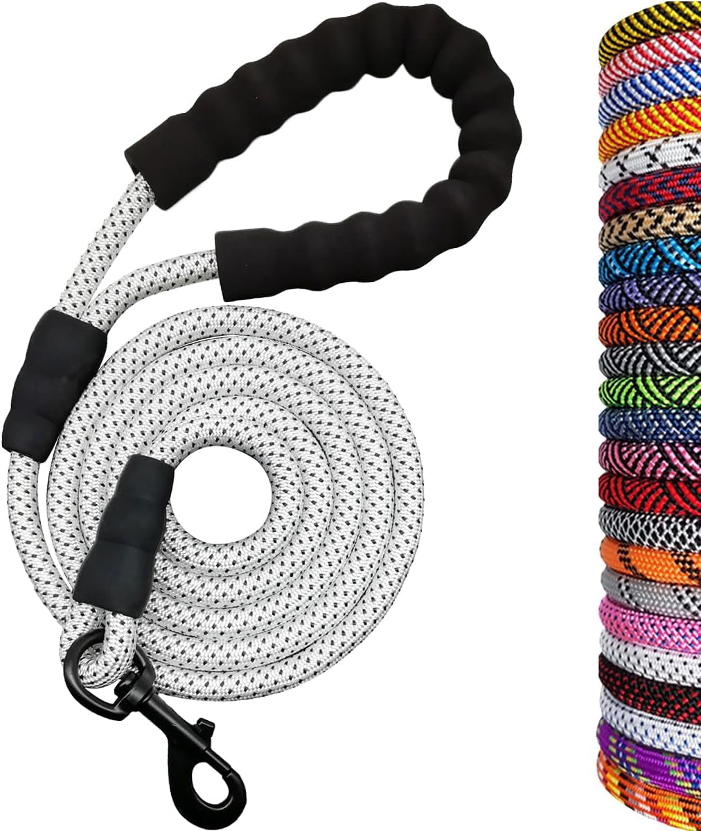 Dog leash with black handle and reflective material, alongside a collection of colorful leashes.