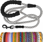 Dog leash with black handle and patterned design, displayed against a white background.